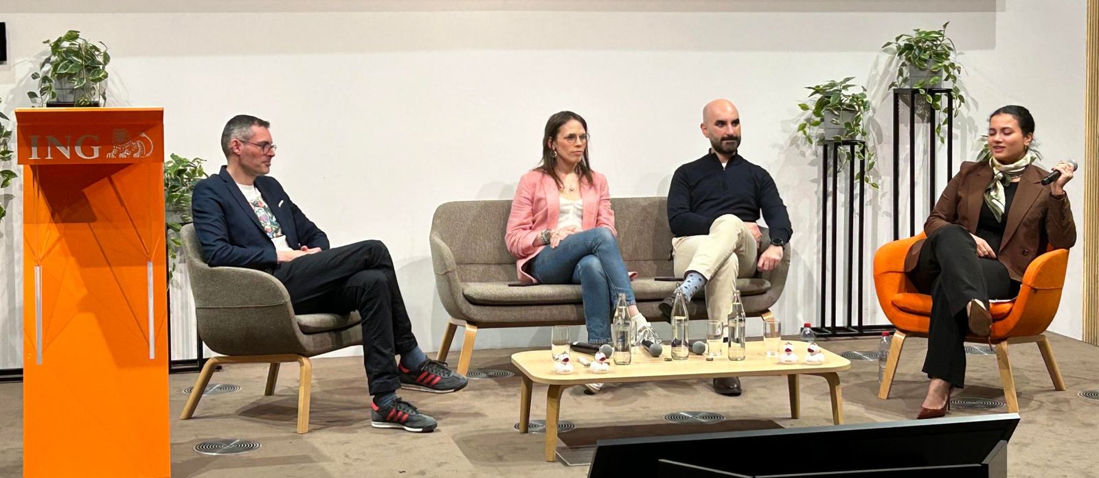 Four panellists, including a Blom co-founder, in conversation on stage at ING Luxembourg next to an orange ING lectern